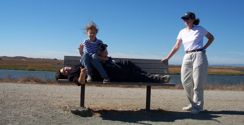 Adam streches out while Julia and Sheba sit down and relax
