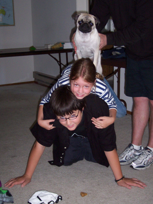 Adam, Julia and Sheba make a pyramid